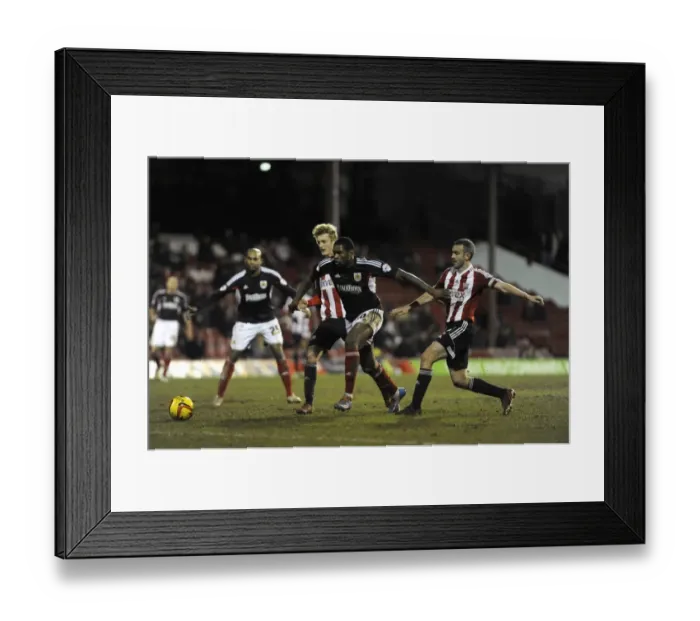 Framed Print : Jay Emmanuel-Thomas Scores Past Brentford Defense in Sky Bet League One Clash