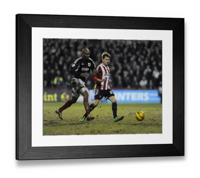 Framed Print : Bristol City's Marvin Elliott Closes In on Brentford's Jake Reeves in Intense League One Clash Framed Print : Bristol City's Marvin Elliott Closes In on Brentford's Jake Reeves in Intense League One Clash