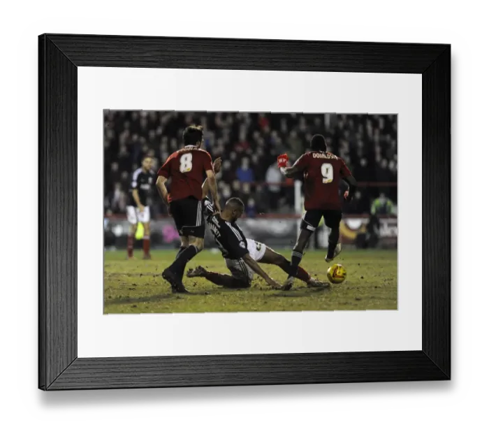 Framed Print : Bristol City's Tyrone Barnett vs. Brentford's Clayton Donaldson - Intense Football Rivalry at Griffin Park (January 2014)