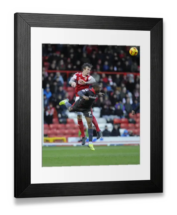 Framed Print : Aden Flint vs. David Amoo: Intense Aerial Battle at Ashton Gate - Bristol City vs. Carlisle United, Sky Bet League One Framed Print : Aden Flint vs. David Amoo: Intense Aerial Battle at Ashton Gate - Bristol City vs. Carlisle United, Sky Bet League One