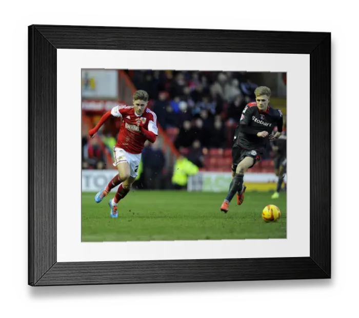 Framed Print : A Fight for Supremacy: Wes Burns vs Brad Potts, Intense Rivalry at Ashton Gate - Sky Bet League One (January 2014)