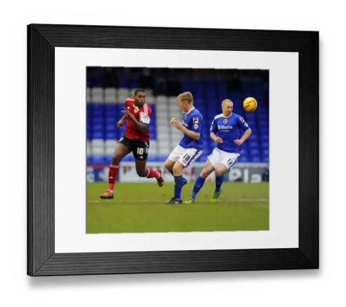 Framed Print : Bristol City's Jay Emmanuel-Thomas Fights for Possession against Oldham Athletic's Lockwood and Mellor