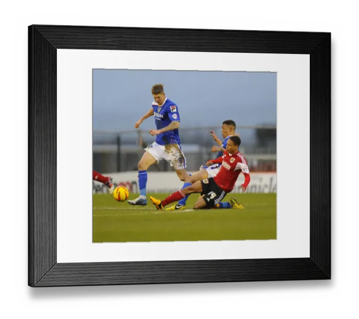 Framed Print : Bristol City's Bobby Reid Tackles Korey Smith in Oldham Athletic Showdown Framed Print : Bristol City's Bobby Reid Tackles Korey Smith in Oldham Athletic Showdown