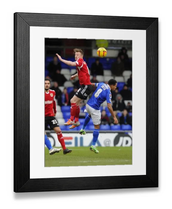 Framed Print : Battling for Supremacy: Wade Elliott vs. Korey Smith in Oldham Athletic vs. Bristol City Football Clash Framed Print : Battling for Supremacy: Wade Elliott vs. Korey Smith in Oldham Athletic vs. Bristol City Football Clash