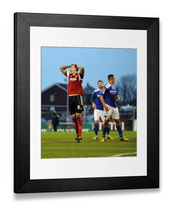 Framed Print : Last-Minute Drama: Aden Flint's Threat Against Oldham Athletic in Sky Bet League One