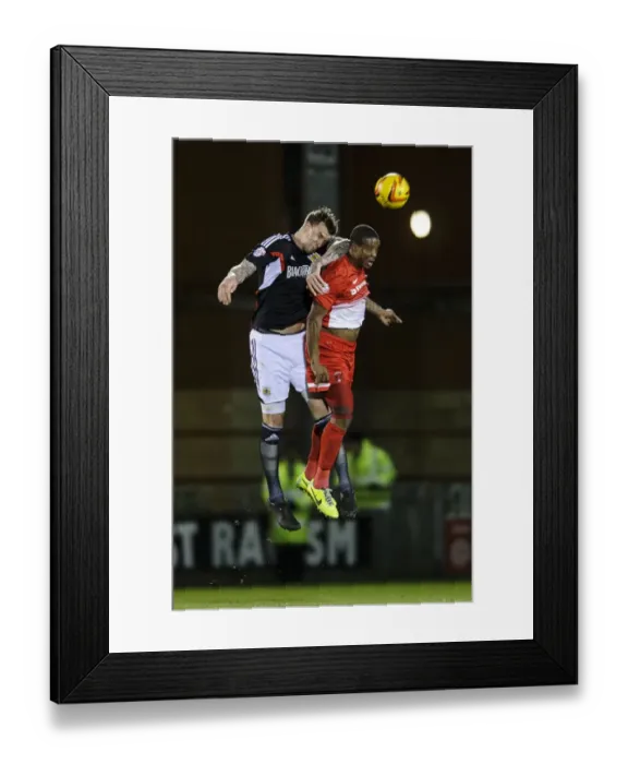 Framed Print : Clash in the Air: Aden Flint vs. Moses Odubajo in Leyton Orient vs. Bristol City Football Match