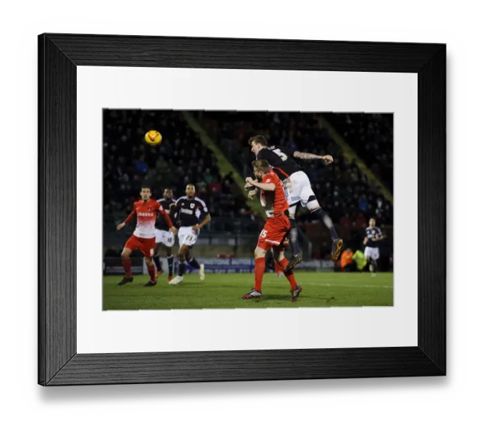 Framed Print : Aden Flint's Determined Charge Towards Goal vs Leyton Orient, February 2014 Framed Print : Aden Flint's Determined Charge Towards Goal vs Leyton Orient, February 2014