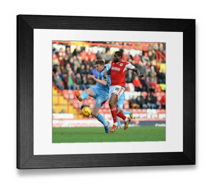 Framed Print : Intense Moment: Jay Emmanuel-Thomas Chases Down Ash Taylor during Bristol City vs Tranmere Rovers