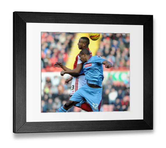 Framed Print : Intense Aerial Clash: Tyrone Barnett vs Stephen Arthurworrey in Bristol City vs Tranmere Rovers Football Match Framed Print : Intense Aerial Clash: Tyrone Barnett vs Stephen Arthurworrey in Bristol City vs Tranmere Rovers Football Match