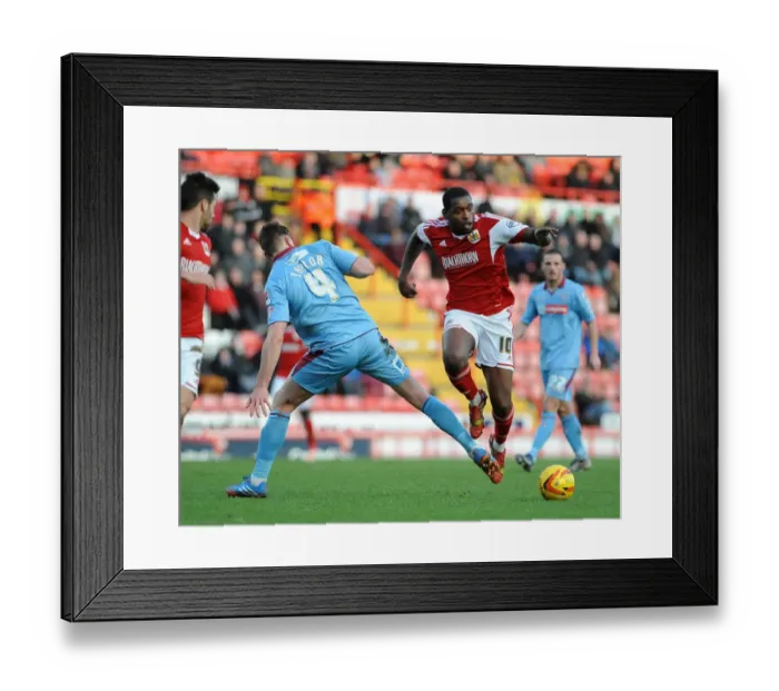 Framed Print : Bristol City's Jay Emmanuel-Thomas Leaps Past Ash Taylor of Tranmere Rovers in Sky Bet League One Clash