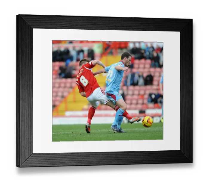 Framed Print : Intense Rivalry: Wade Elliott vs Jason Koumas - A Footballing Battle in the Sky Bet League One Clash between Bristol City and Tranmere Rovers