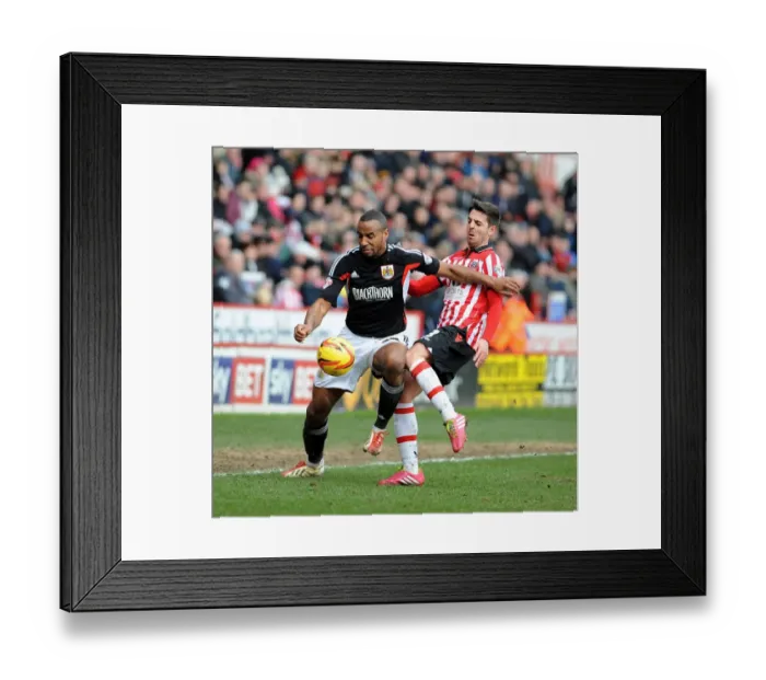 Framed Print : Bristol City's Tyrone Barnett vs Sheffield United's Bob Howard: Intense Battle at Bramall Lane, February 2014