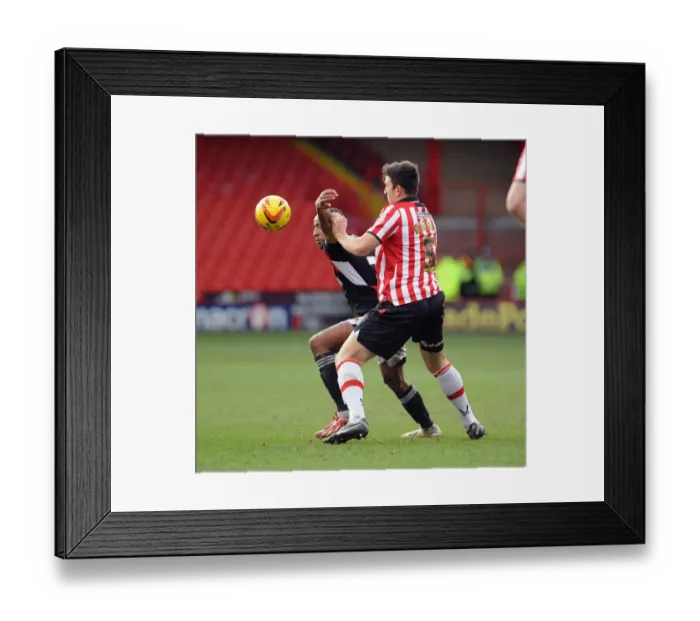 Framed Print : Maguire vs Barnett: Intense Battle for the Ball in Sheffield United vs. Bristol City Football Match, 2014 Framed Print : Maguire vs Barnett: Intense Battle for the Ball in Sheffield United vs. Bristol City Football Match, 2014