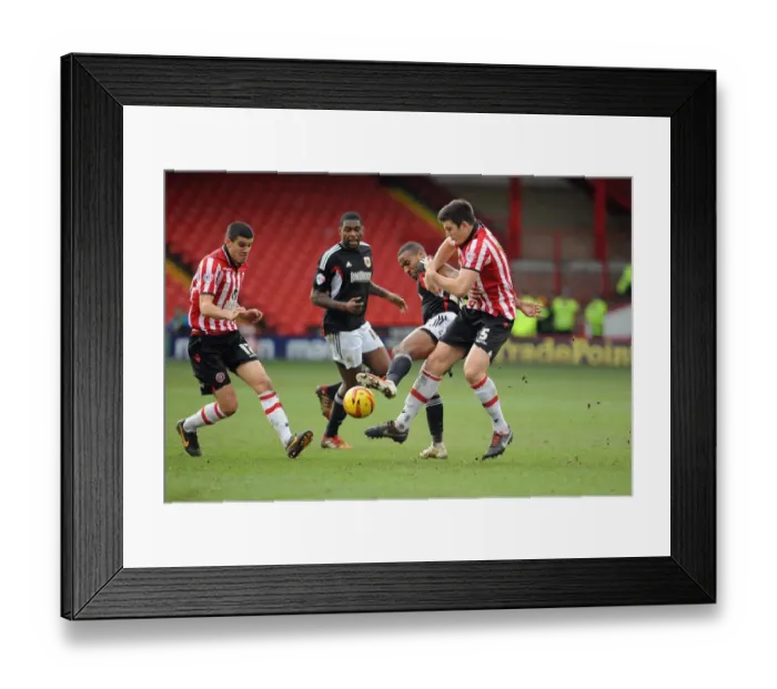 Framed Print : Tyrone Barnett vs. Harry Maguire: Intense Battle for the Ball in Sheffield United vs. Bristol City Football Match, 2014 Framed Print : Tyrone Barnett vs. Harry Maguire: Intense Battle for the Ball in Sheffield United vs. Bristol City Football Match, 2014
