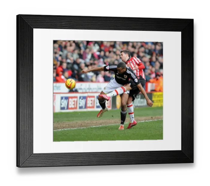 Framed Print : Bob Howard vs Tyrone Barnett: Intense Battle for the Ball in Sheffield United vs Bristol City Football Match, 2014