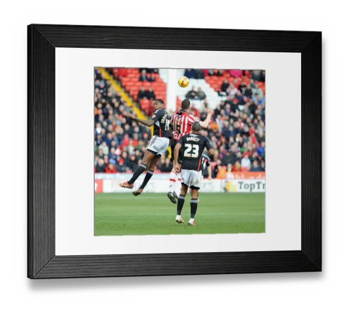 Framed Print : Clash at Bramall Lane: Jay Emmanuel-Thomas Battles Neil Collins for Aerial Supremacy in Sheffield United vs. Bristol City Football Match, 2014