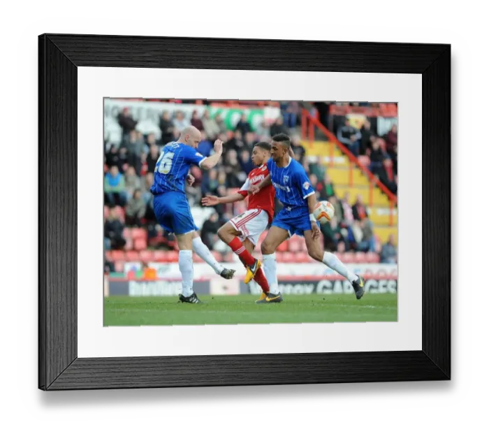Framed Print : Bristol City vs Gillingham: Intense Moment as Bobby Reid Closes In, Adam Barrett Clears the Ball Framed Print : Bristol City vs Gillingham: Intense Moment as Bobby Reid Closes In, Adam Barrett Clears the Ball
