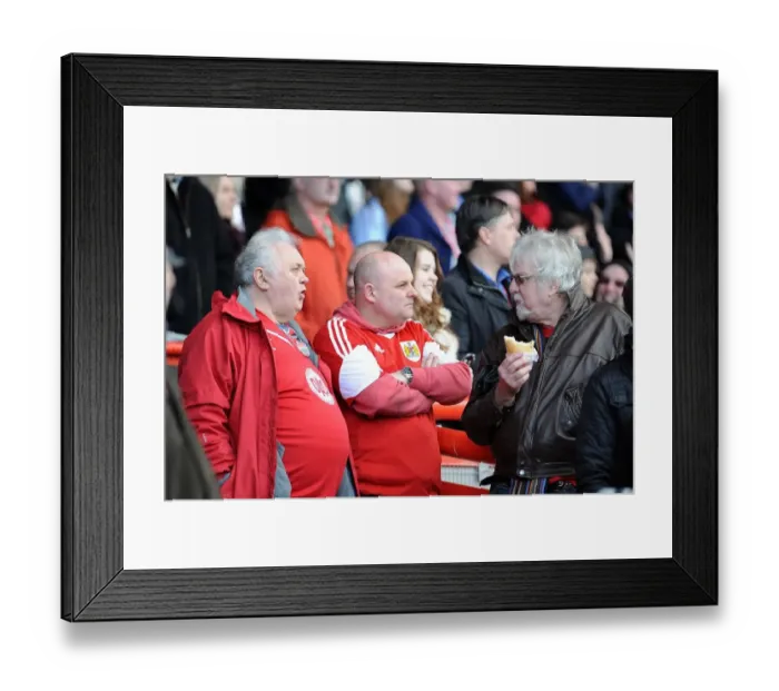 Framed Print : Fan Enjoying New Home-made Pasty at Ashton Gate Stadium during Reading vs Yeovil Town Match, Sky Bet Championship