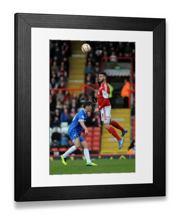 Framed Print : Bristol City's Derrick Williams Wins a Header in Sky Bet League One Clash Against Gillingham Framed Print : Bristol City's Derrick Williams Wins a Header in Sky Bet League One Clash Against Gillingham