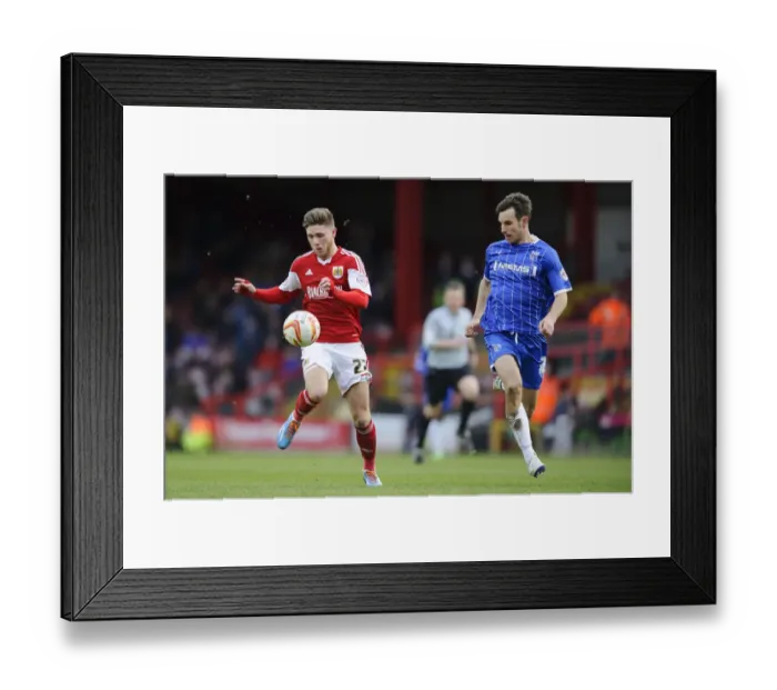 Framed Print : Bristol City vs Gillingham: Wes Burns vs Steven Gregory - Intense Football Clash at Ashton Gate Framed Print : Bristol City vs Gillingham: Wes Burns vs Steven Gregory - Intense Football Clash at Ashton Gate