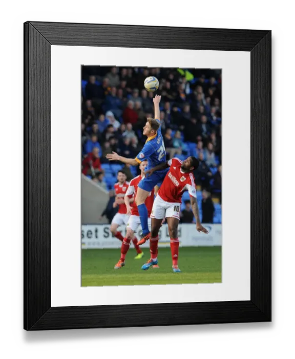 Framed Print : Challenge in the Air: Asa Hall vs. Jay Emmanuel-Thomas in Shrewsbury Town vs. Bristol City Football Match