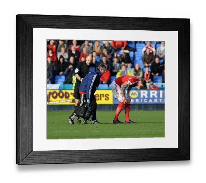 Framed Print : Aden Flint Substitution: Bristol City's Defender Leaves the Field with a Knee Injury During Shrewsbury Town Match