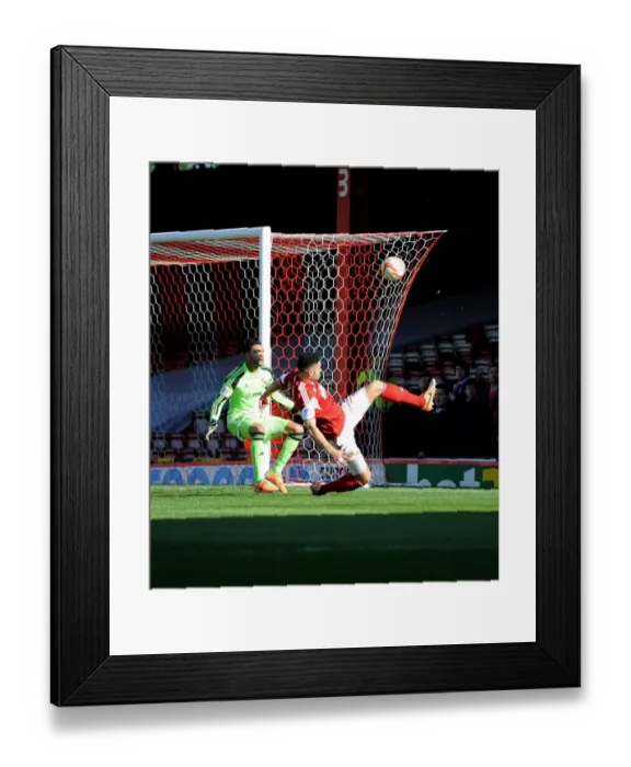 Framed Print : Bristol City's Derrick Williams Reaches for the Ball in Intense Football Action Framed Print : Bristol City's Derrick Williams Reaches for the Ball in Intense Football Action