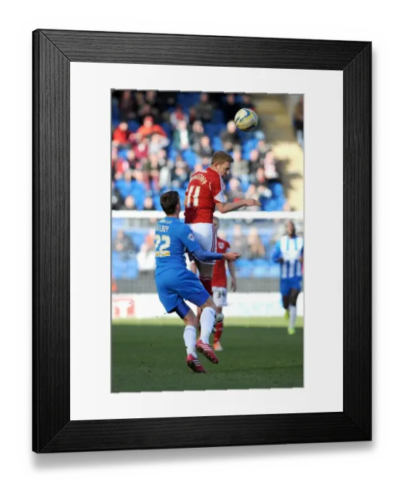 Framed Print : Bristol City's Scott Wagstaff Battles for a Header Against Colchester United's Alex Gilbey during Sky Bet League One Match Framed Print : Bristol City's Scott Wagstaff Battles for a Header Against Colchester United's Alex Gilbey during Sky Bet League One Match