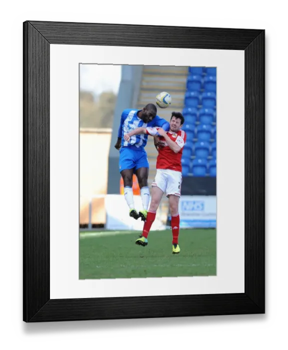Framed Print : Brendan Moloney vs Jabo Ibehre: Aerial Battle in Colchester United vs Bristol City Football Match, Sky Bet League One (2014) Framed Print : Brendan Moloney vs Jabo Ibehre: Aerial Battle in Colchester United vs Bristol City Football Match, Sky Bet League One (2014)