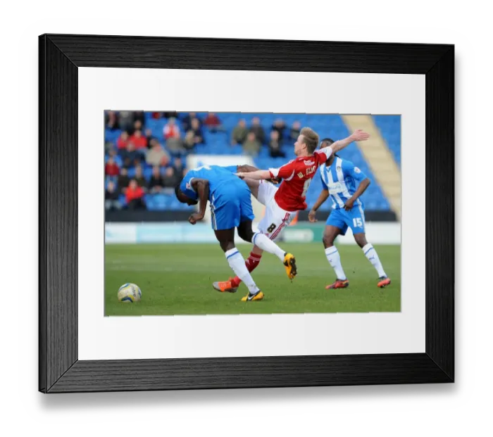 Framed Print : Wade Elliott vs Magnus Okuonghae: Intense Battle for the Ball in Colchester United vs Bristol City Football Match, Sky Bet League One, 2014 Framed Print : Wade Elliott vs Magnus Okuonghae: Intense Battle for the Ball in Colchester United vs Bristol City Football Match, Sky Bet League One, 2014