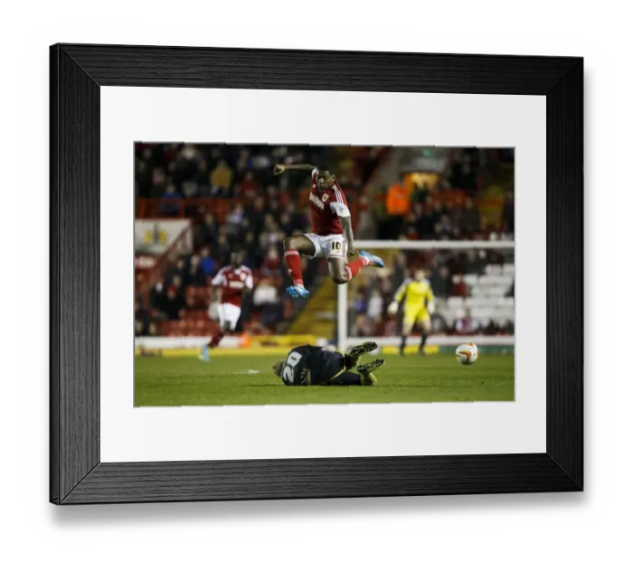 Framed Print : Bristol City's Jay Emmanuel-Thomas Leaps Over Port Vale's Jack Grimmer in Sky Bet League One Clash