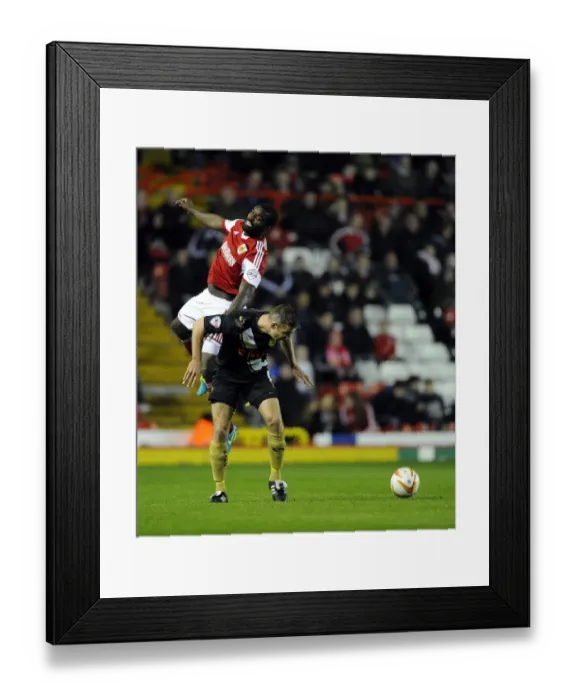Framed Print : Battling for Supremacy: Osborne vs. Pope in Intense Sky Bet League One Clash