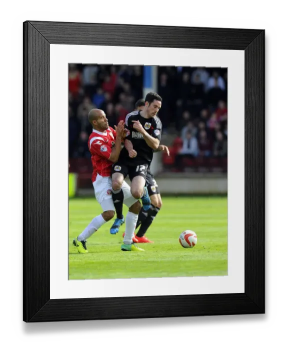 Framed Print : Battling for Supremacy: Greg Cunningham vs. Adam Chambers in Walsall vs. Bristol City Football Match, April 2014