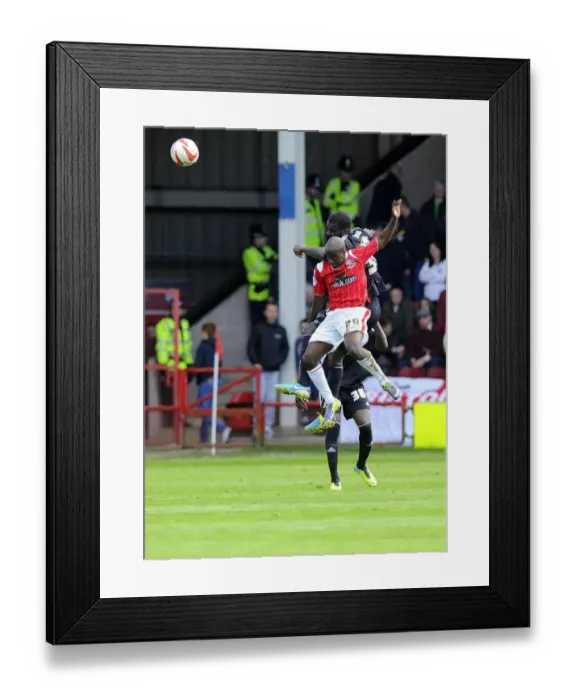 Framed Print : Battling for Supremacy: Osborne vs. Brandy in Walsall vs. Bristol City Football Clash