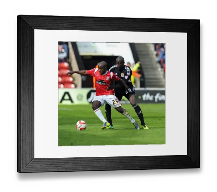 Framed Print : Bristol City's Nyron Nosworthy vs. Walsall's Febian Brandy: A Battle for the Ball