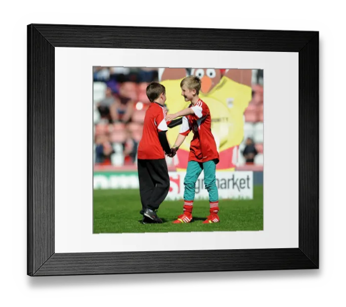 Framed Print : Young Rivals Leo Worlock and Luca Fortuna: Celebrating Bristol City's Victory with Unmatched Camaraderie