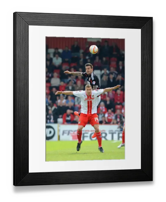 Framed Print : Marlon Pack vs. Simon Heslop: Intense Rivalry on the Football Field - Stevenage vs. Bristol City, 2014