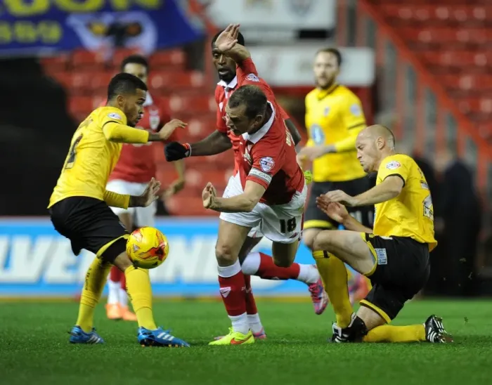 Framed Print : Aaron Wilbraham Fouled by Adam Barrett in Johnstone's Paint Trophy Match: Bristol City vs AFC Wimbledon