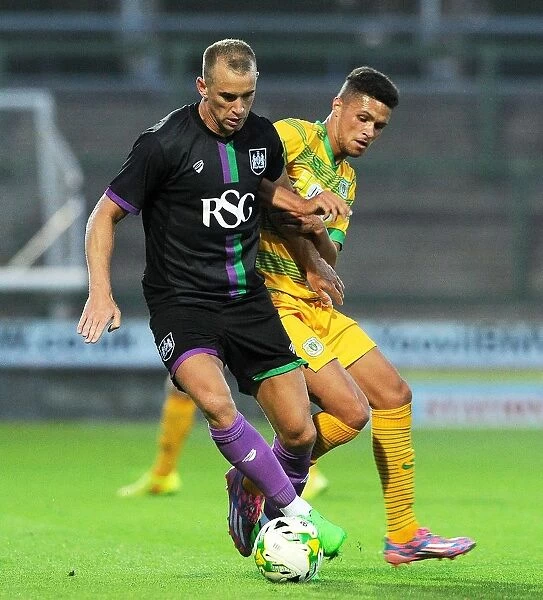 Aaron Wilbraham vs Jamie Burrows: Intense Moment in the Pre-Season Clash between Yeovil Town and Bristol City