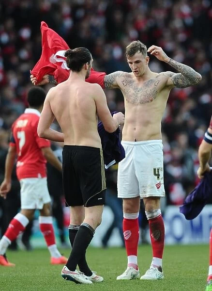 Aden Flint and Andy Carroll Exchange Shirts: A Moment from Bristol City vs. West Ham United FA Cup Match, January 2015
