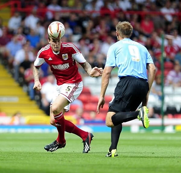 Aden Flint Clears the Ball Under Pressure: Bristol City vs. Bradford City, Sky Bet League One, 2013