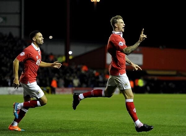 Aden Flint and Derrick Williams Celebrate Double Strike: Bristol City's Victory Moment vs. Bradford City (October 2014)