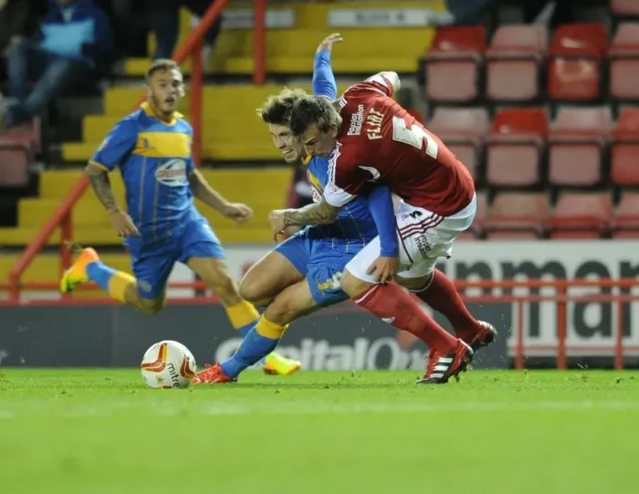 Framed Print : Aden Flint Fouls Tom Bradshaw in Bristol City vs Shrewsbury Town Football Match, September 13, 2013