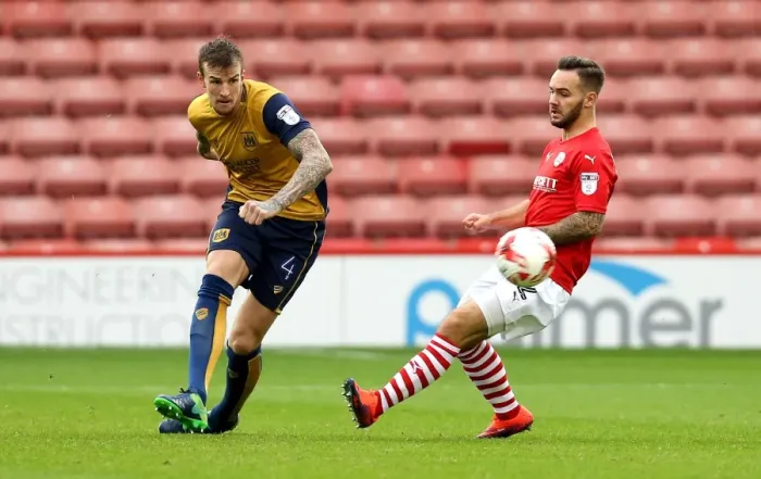 Framed Print : Aden Flint Passes Forward for Bristol City at Oakwell Stadium, 2016