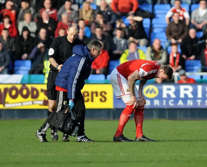 Framed Print : Aden Flint Substitution: Bristol City's Defender Leaves the Field with a Knee Injury During Shrewsbury Town Match