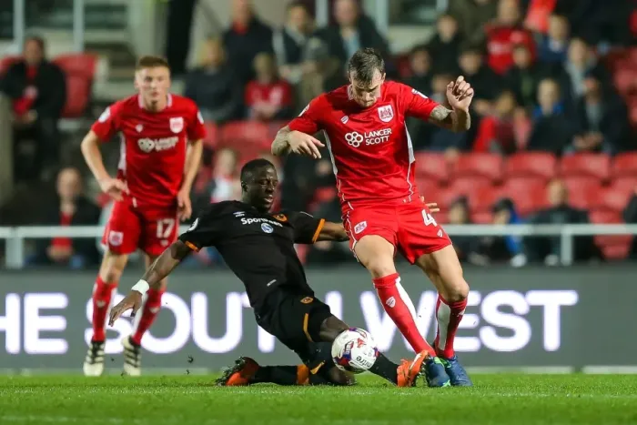 Framed Print : Aden Flint vs Adama Diomande: Intense Battle in Bristol City vs Hull City EFL Cup Clash