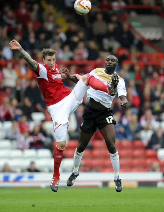 Framed Print : Aden Flint vs Jabo Ibehre: Intense Aerial Battle at Ashton Gate - Bristol City vs Colchester United, Sky Bet League One