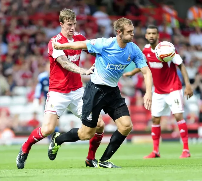 Framed Print : Aden Flint vs. James Hanson: Intense Rivalry at Ashton Gate - Bristol City vs. Bradford City, Sky Bet League One (August 2013)