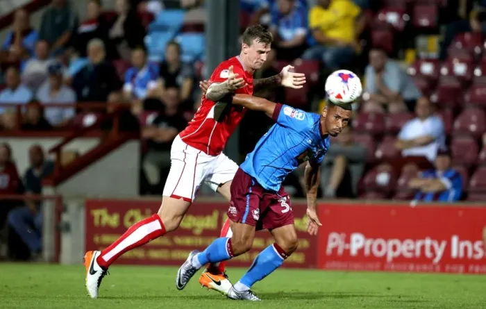 Framed Print : Aden Flint vs Jordan Clarke: Intense Battle for Ball Possession at Glanford Park, Scunthorpe United vs Bristol City, EFL Cup 2016 Framed Print : Aden Flint vs Jordan Clarke: Intense Battle for Ball Possession at Glanford Park, Scunthorpe United vs Bristol City, EFL Cup 2016
