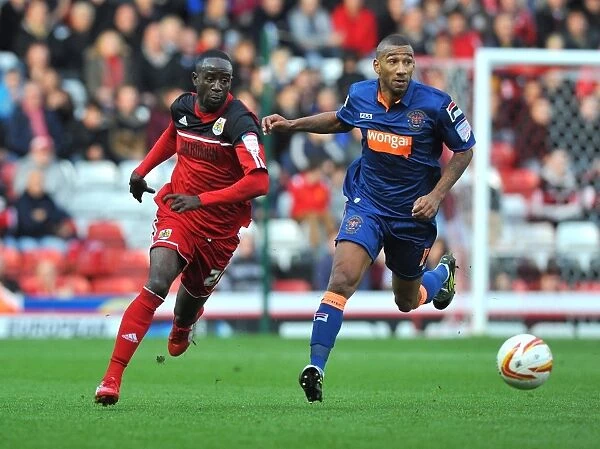 Adomah Outmaneuvers Grandin: Intense Moment from Bristol City vs. Blackpool Championship Match, 17th November 2012